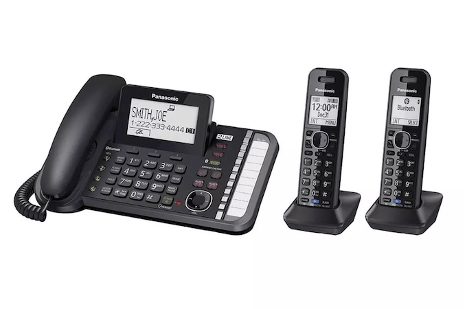 Panasonic KX-TG958 shown with a corded phone and two wireless phones